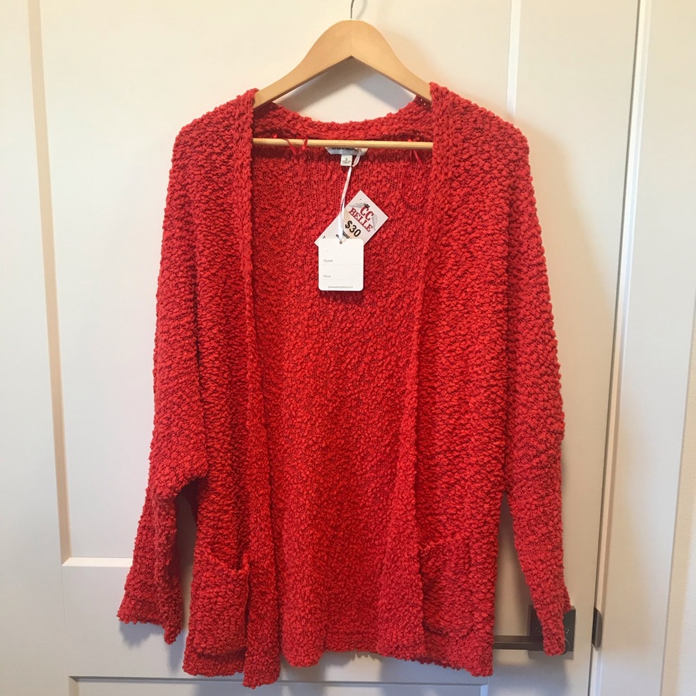 Orange popcorn cardigan size small. NWT